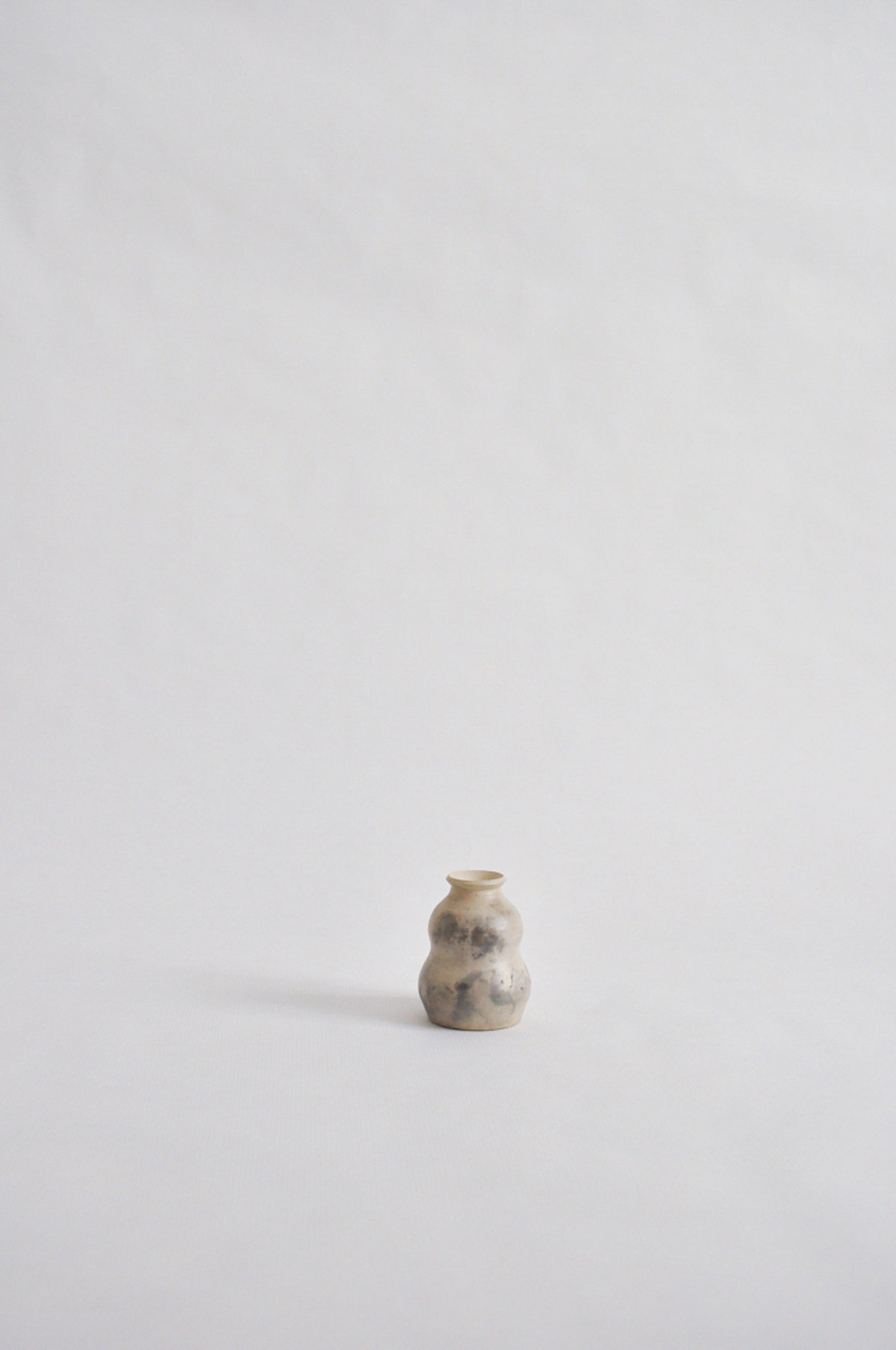 tiny wheel thrown vase, fired in a pit