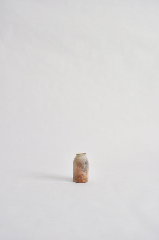 tiny wheel thrown vase, fired in a pit